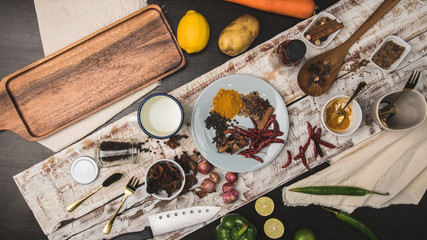 Healthy food herbs Spices for use as cooking ingredients on a wooden background with Fresh organic vegetables on wood.