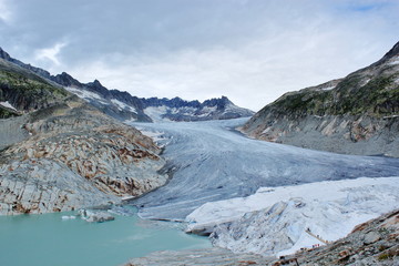 Huge glacier and beautiful mountain lake at top of mountain. Excursion to ice cave in Swiss Alps....
