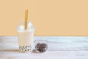 Bubble milk tea on wooden table with copy space
