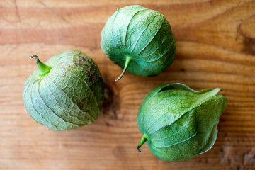 Close up of tomatillos on wooden table