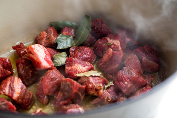 Close up of beef carbonnade cooking in saucepan