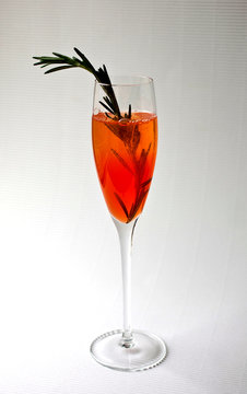 Close up of auld lang punch served with infused rosemary on table
