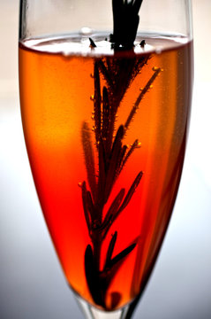 Close up of auld lang punch served with infused rosemary