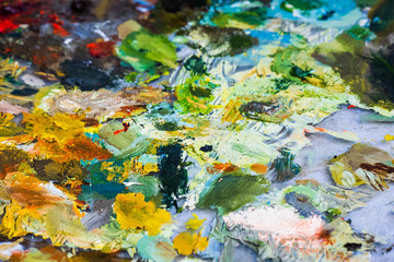 Fototapeta na wymiar Painter's color palette, acrylic and oil paint multicolor