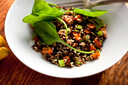 Roasted balsamic winter squash and wild rice salad in bowl