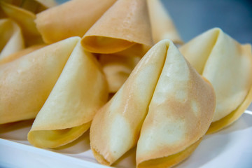 surprise fortune cookies on white plate