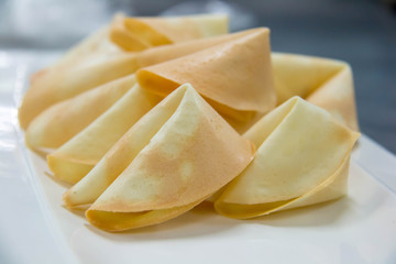  surprise fortune cookies on white plate