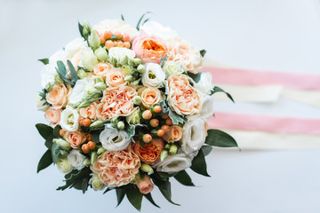 Beautiful wedding bouquet decorated with white and pink roses, bridal flowers of pastel colour