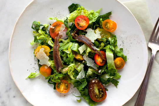 Overhead view of Caesar salad on plate