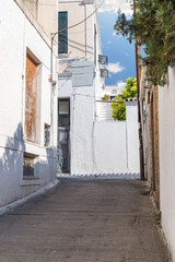 Walking on traditioanal greek streets with white house, Spetses Saronic gulf, Greece