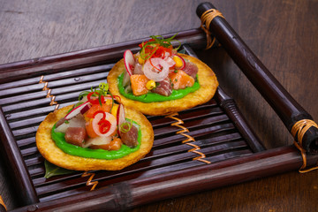 Taco with tuna and salmon