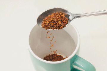 Instant coffee on spoon