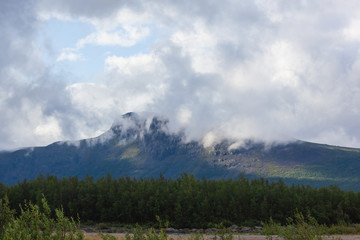 Clouds cling to tops of mountains of Sarek national park, Norrbotten County, Northern Swedish