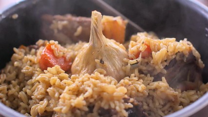 Pilaf with beef, carrots, onions, garlic and pepper. A traditional dish of Asian cuisine