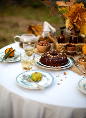 chocolate bundt cake with chocolate glaze on vintage plates on table with grey tablecloth