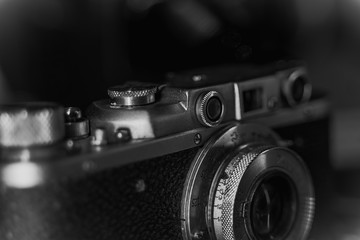 Close up of vintage camera. old retro technology. black and white photo. grunge effect.