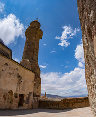 Dogubayazıt, Turkey, Middle East: view of the minaret of the mosque Eski Bayezid Cami and Ishak Pasha Palace, semi-ruined palace and administrative complex of Ottoman period built from 1685 to 1784