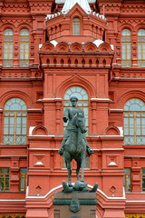  Georgy Zhukov monument against the background of Historical Museum of Russia.