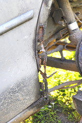 old car with rusty rer fender