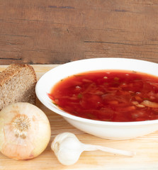  still life borscht plate, onions, garlic, bread.