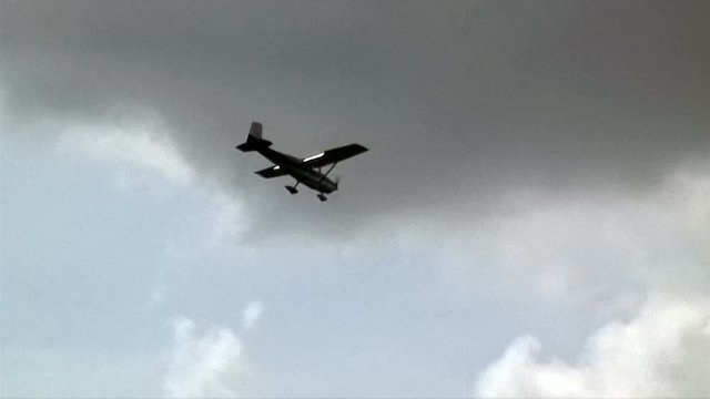 A small prop plane circles in for a landing