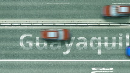 Aerial down view of the motorway with cars revealing Guayaquil caption. Car travel to Ecuador intro clip