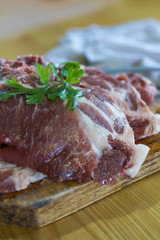fresh veal chop meat on wood
