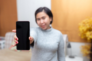 attractive asian woman using smart phone