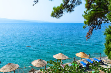 Sun beds and umbrellas at bleach club in Mugla, Turkey