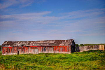 Farm structures among wheat fields in the Alberta countryside