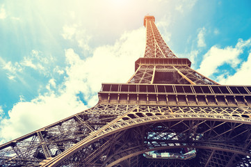 Eiffel Tower against the blue sky in Paris, France. Vintage filter, retro effect