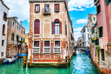 Scenic canal with old architecture in Venice, Italy. Famous travel destination