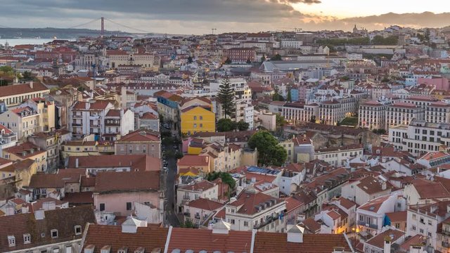 Lisbon Portugal time lapse 4K, aerial view city skyline day to night sunset timelapse at Lisbon Baixa district