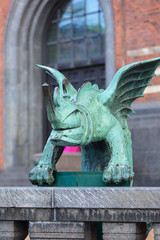 Copenhagen City Hall, green mascaron on the fence at the entrance to the building, Copenhagen,...