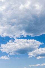 Obraz premium White fluffy clouds in the blue sky in summer