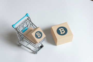 box with bitcoin in shopping cart
