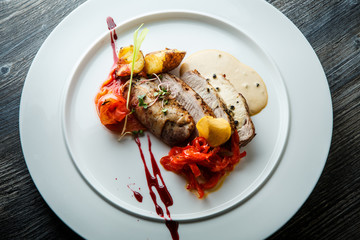 top view closeup baked meat pieces with grilled vegetables