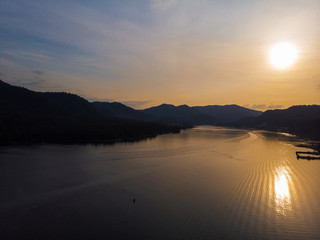 Aerial view on Teletskoye lake in Altai mountains, Siberia, Russia. Drone shot. Beauty summer sunset .