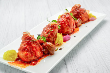 Chicken baked in tomato sauce, with vegetables