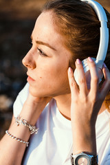 Young woman with her laptop listened external communications