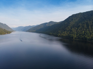Fototapeta premium Aerial view on Teletskoye lake in Altai mountains, Siberia, Russia. Drone shot. Beauty summer day.