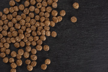 Lot of whole chocolate ball breakfast cereals flatlay on grey stone