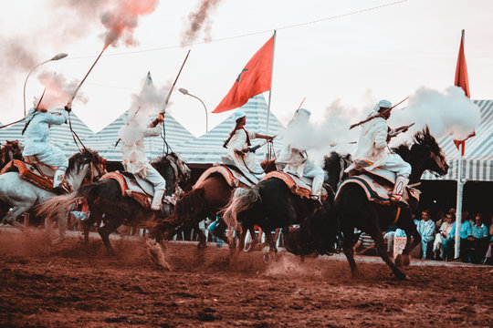 Tbourida Fantasia Morocco inezgane festival kssima knights on horses show with arms