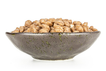 Lot of whole chocolate ball breakfast cereals on grey ceramic plate isolated on white background