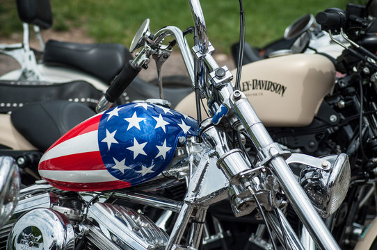 Gerarmer - France -26 May 2018 - closeup of motorbike tank with american flag painting on Harley Davidson motorbike parked in the street