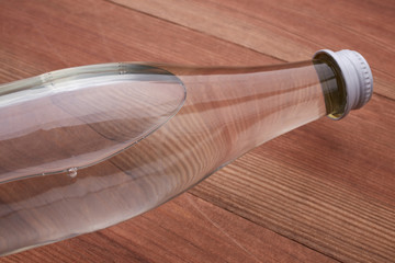 glass water bottle on a wooden table