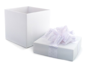 White gift box with white ribbon.