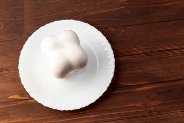 wooden background. white plate. Gypsum tooth. equipment.