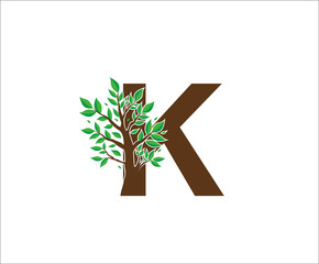 Abstract K Logo Letter Made From Brown Tree Branches with green leaves. Tree Letter Design with Minimalist Creative Style.