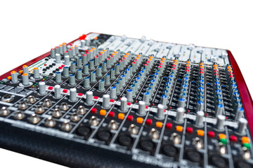 Close up photo of a professional sound mixer with many adjustments, knob switches and buttons of audio mixer control panel.